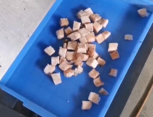 Cut frozen fish fillets into cubes